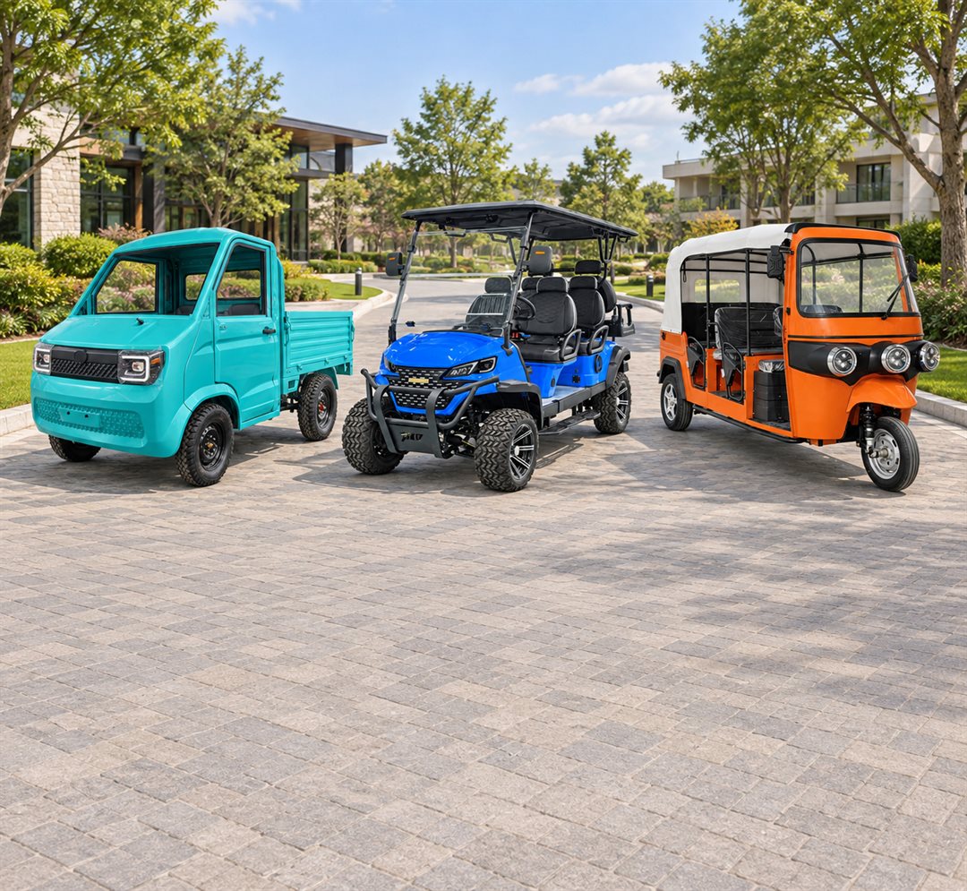 Turquoise pickup, blue golf cart and orange tuk tuk on a paved area